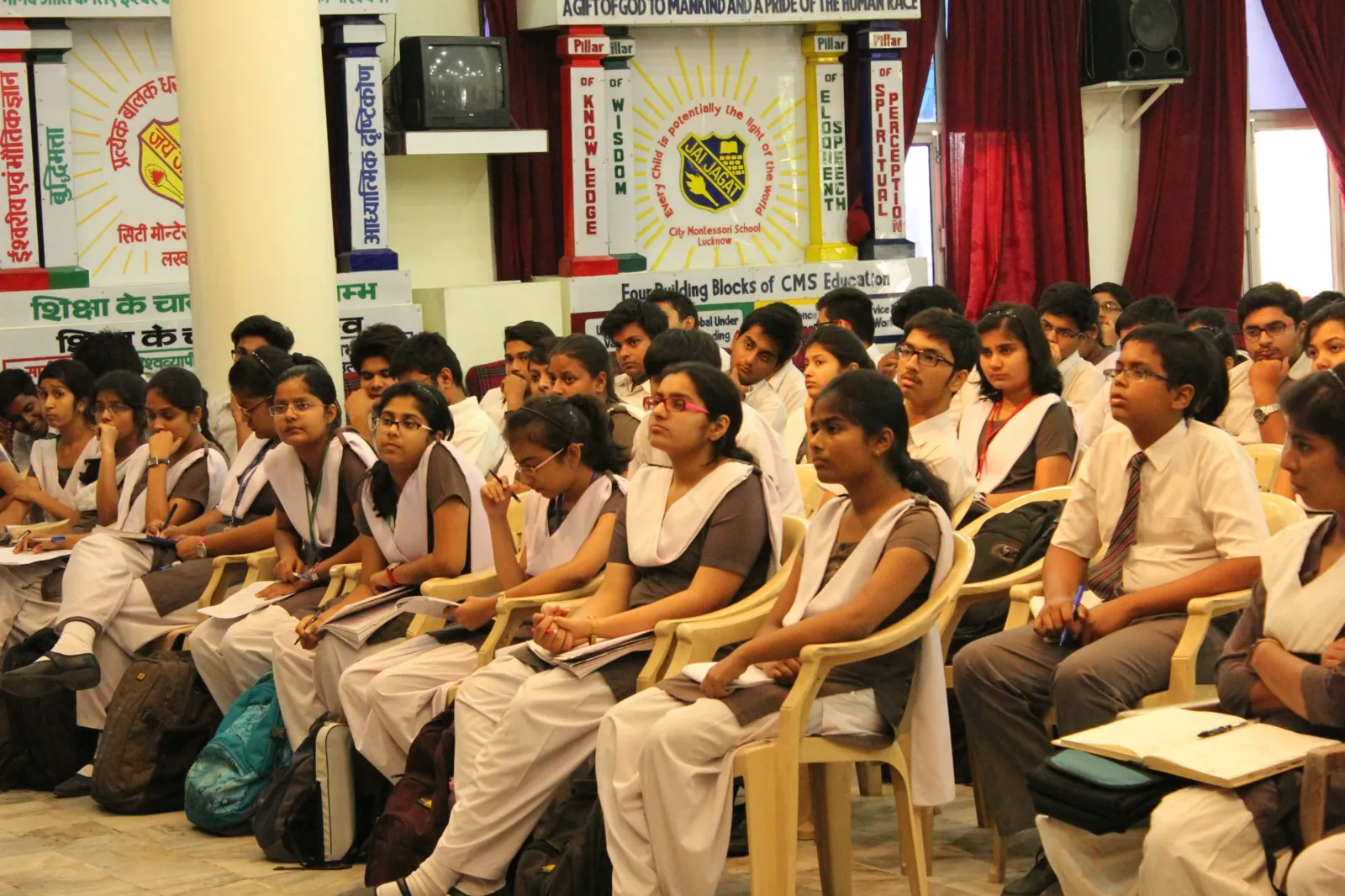 Students taking notes in a session