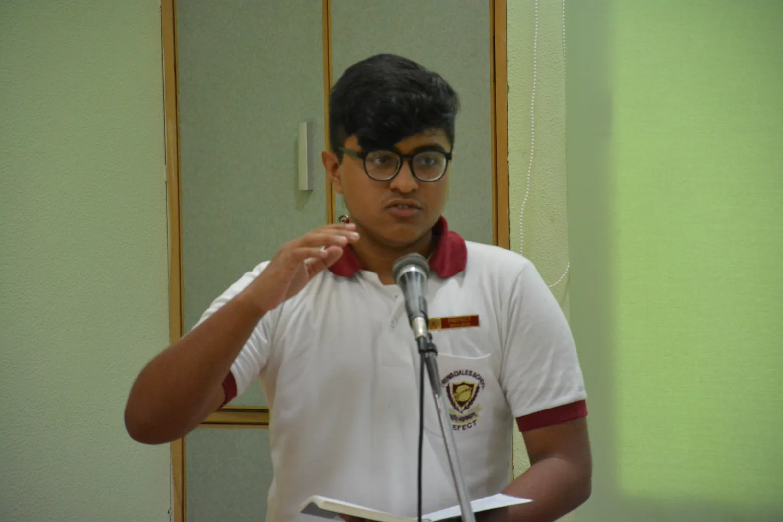 A student speaking at the microphone
