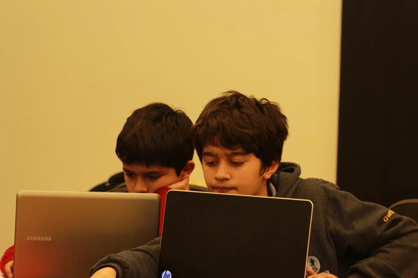 Two students working on laptops in a Brainwiz session