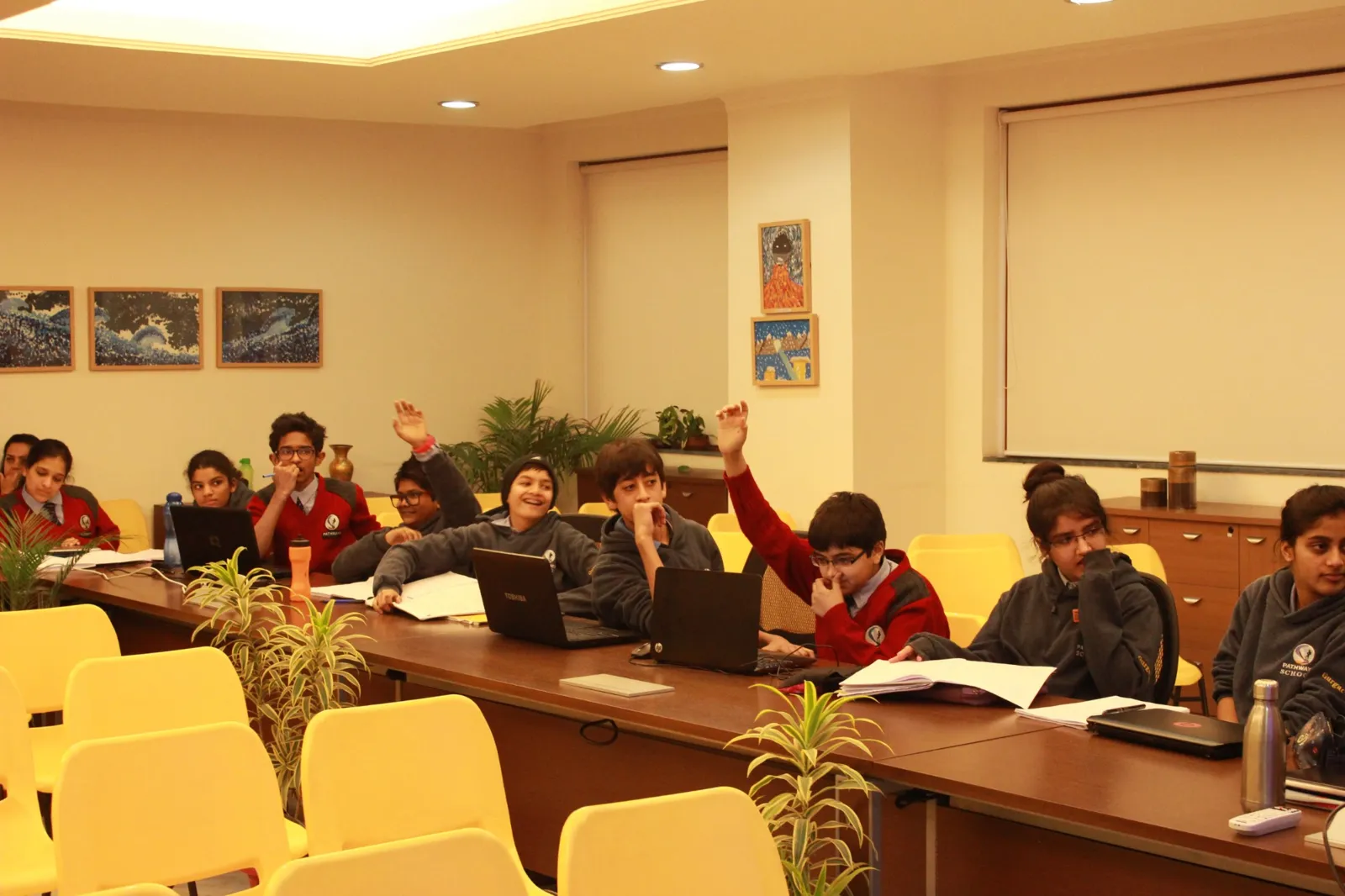 Participants raising hands to vote