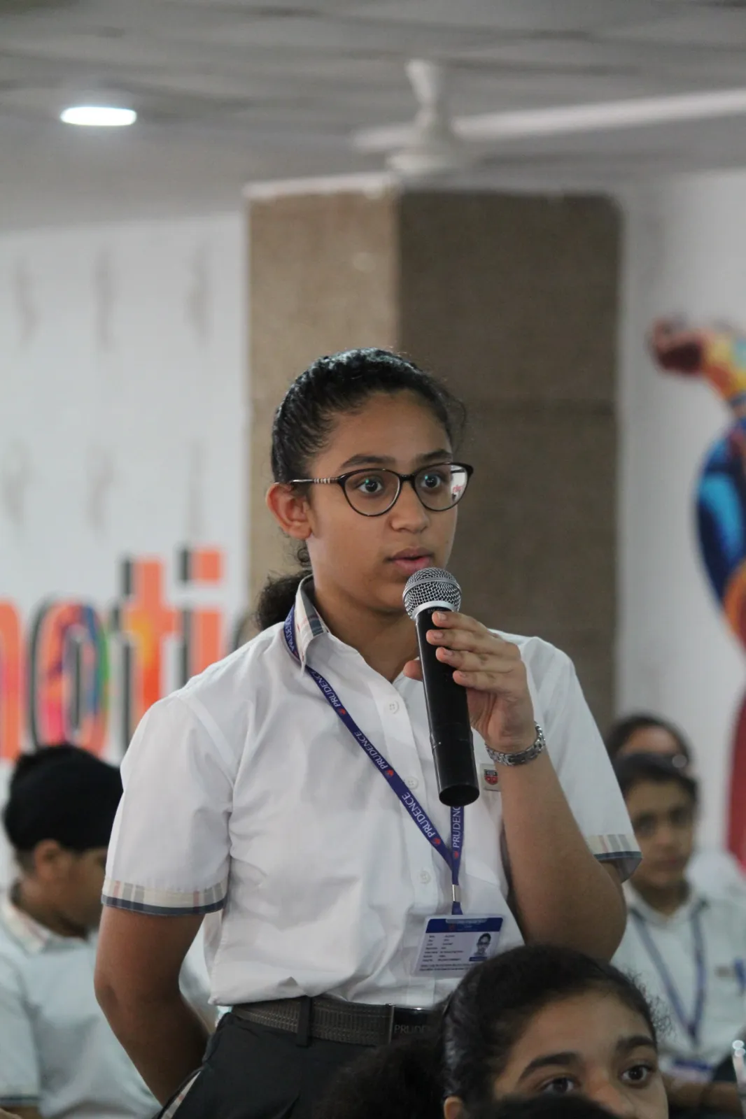 A participant sharing her thinking on the microphone