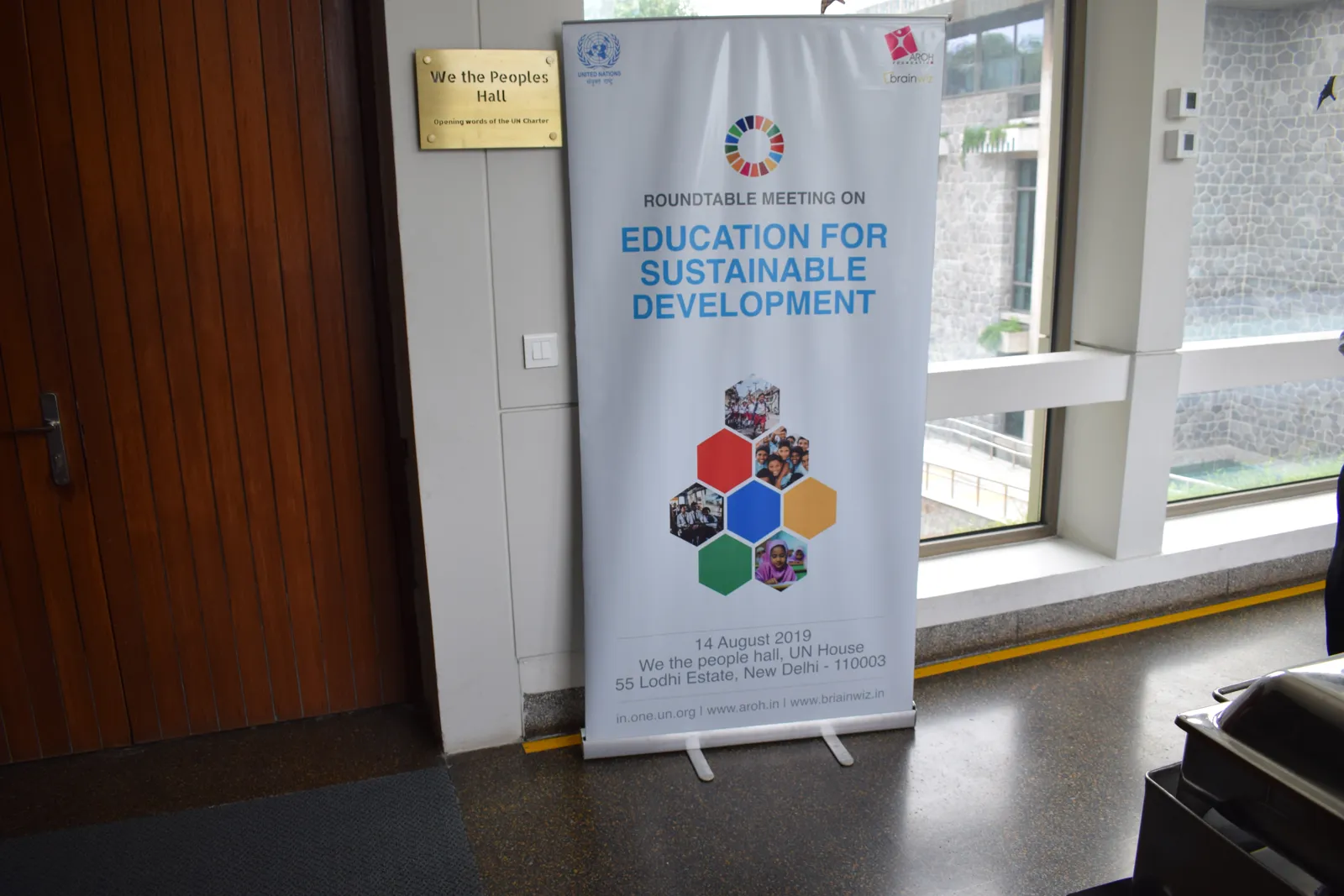 Roundtable standee outside We the Peoples Hall, UN House