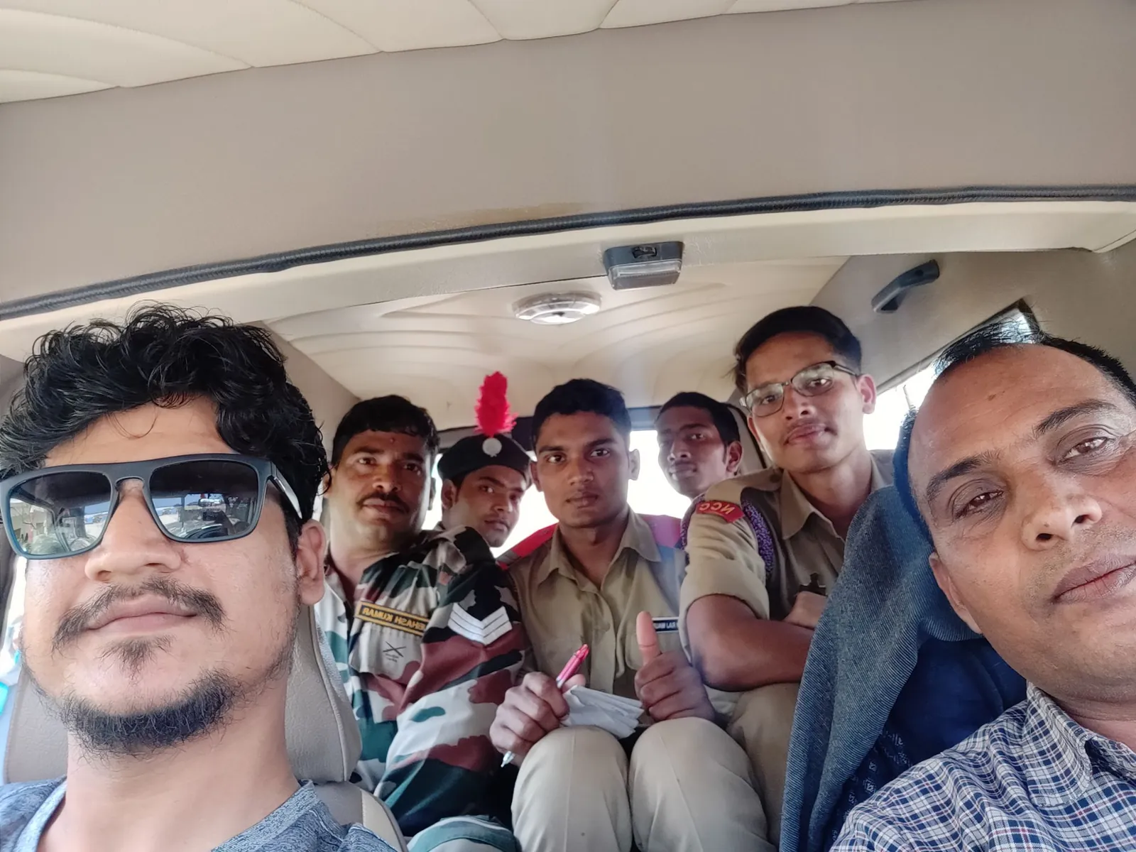 The Brainwiz team with cadets and NCC staff in a vehicle